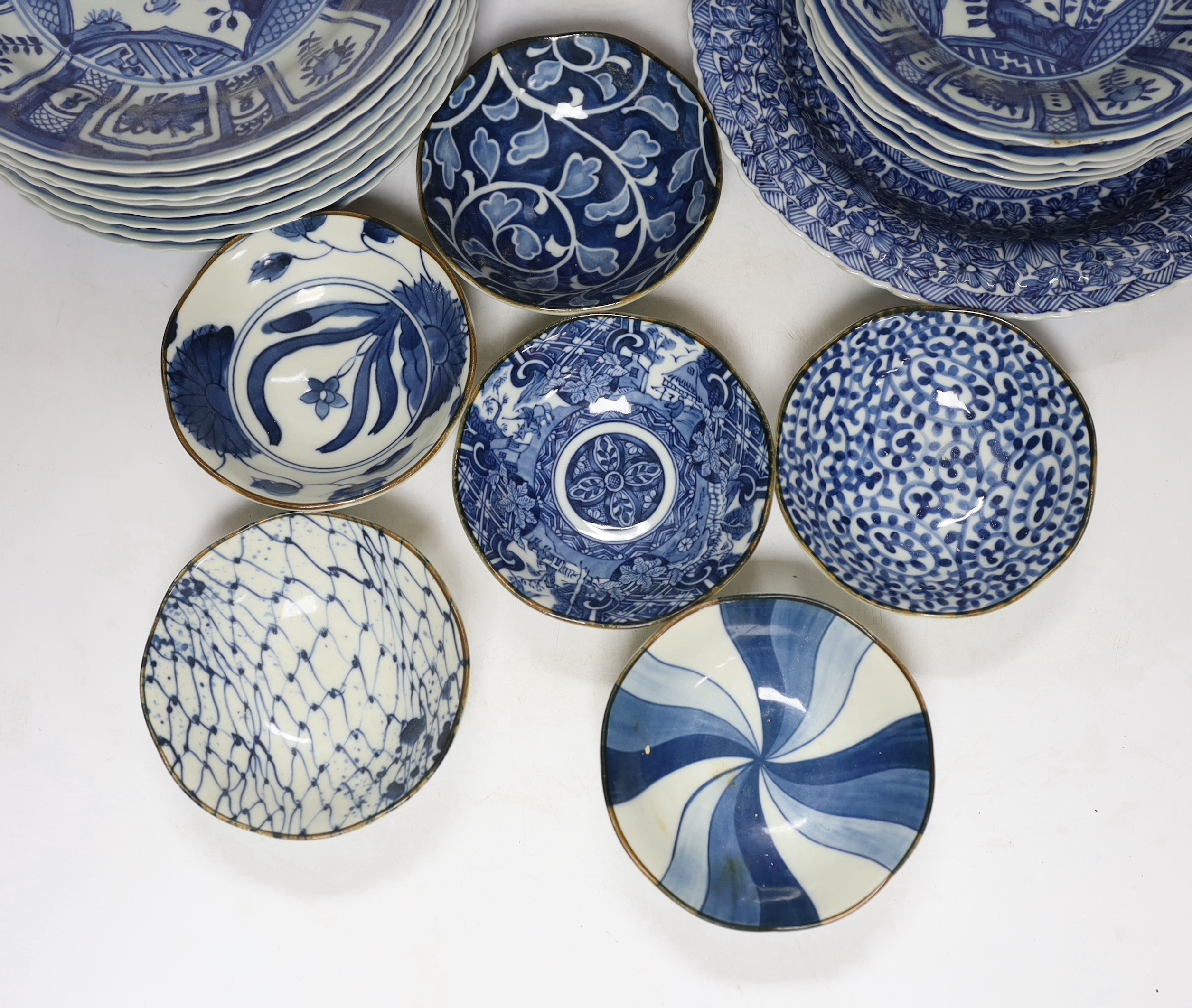 A group of Chinese blue and white dishes and plates and a damaged vase, 30cm